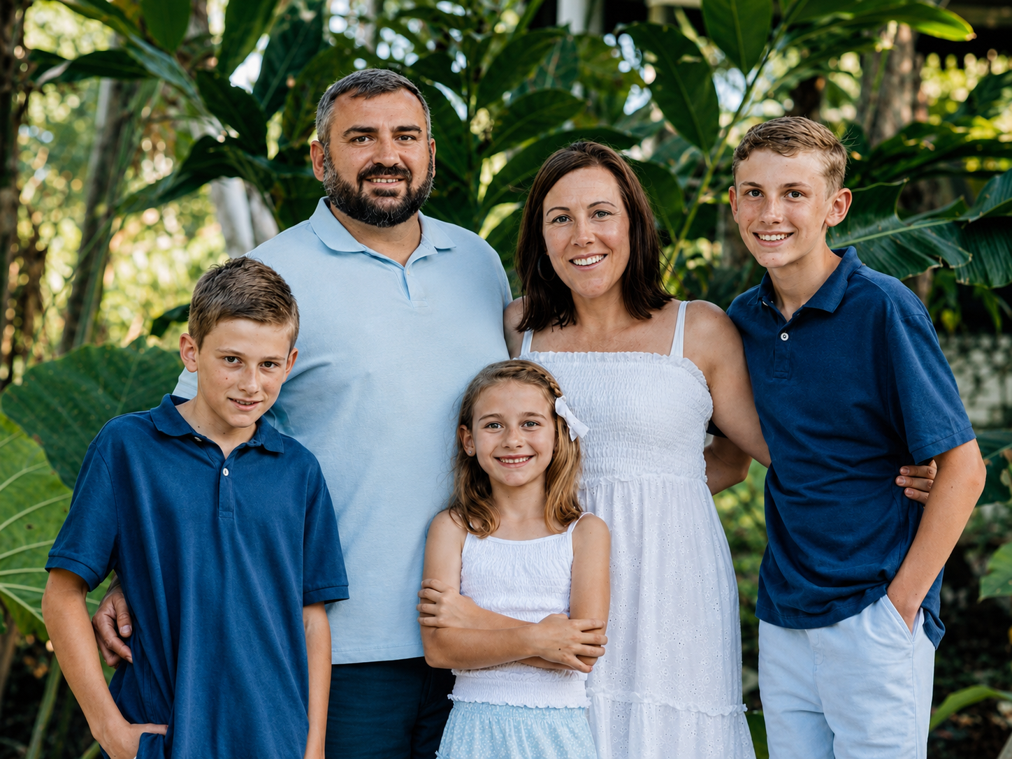 The Tabacaru family, Lucian, Jaylyne, Isaac, Noah and Lavinia, smiling together in Vanuatu